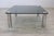 This exquisite coffee table is a true testament to the elegant and innovative spirit of 20th century Italian design,...