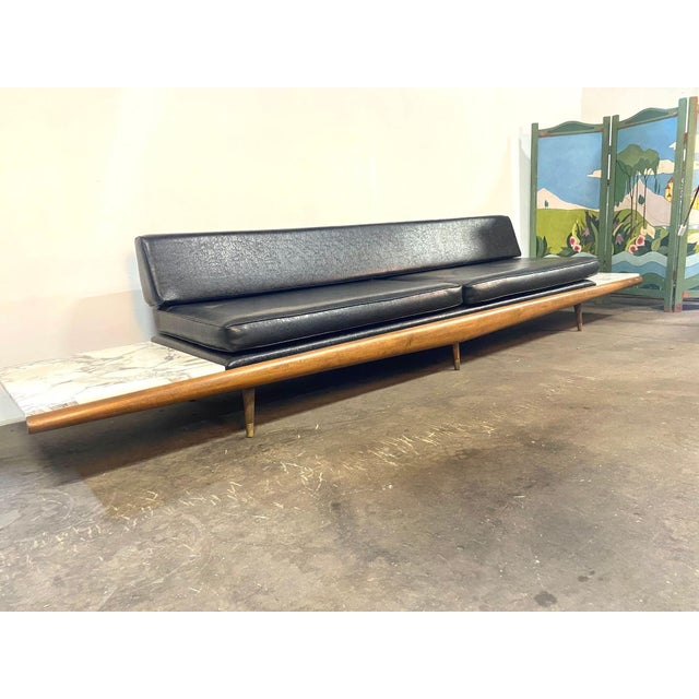 A vintage 1960's Adrian Pearsall Attributed daybed in Walnut, with Carrera marble end tables, upholstered in the original...