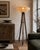 A highly decorative industrial floor lamp created from an authentic English surveyor's tripod dating from the early 20th...