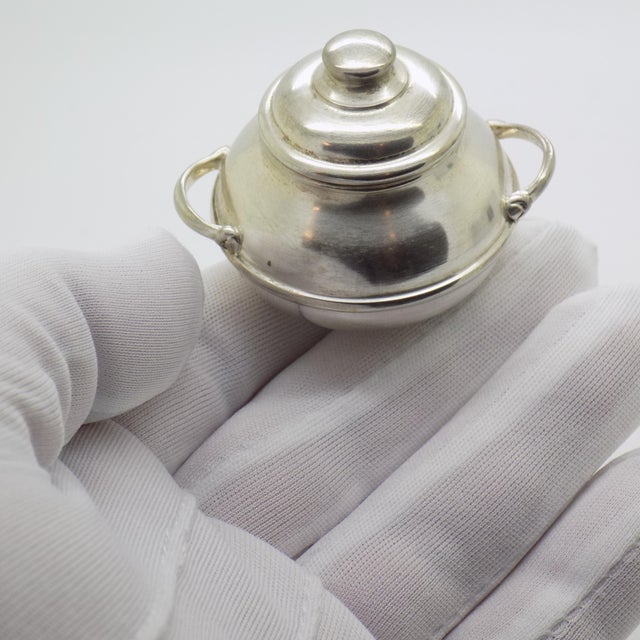 This delightful vintage miniature depicts a dollhouse-scale cooking pot, handcrafted in Florence, Tuscany, Italy, during...