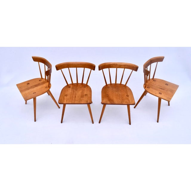 An exceptional set of iconic Mid-Century Modern solid Maple spindle back dining chairs by Paul McCobb for Winchendon...