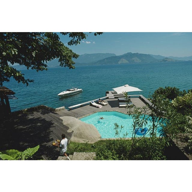 Pool by the Sea 1985 A swimming pool and lounge deck over the sea at Angra Dos Reis, Brazil, 1985. (Photo by Slim Aarons)...