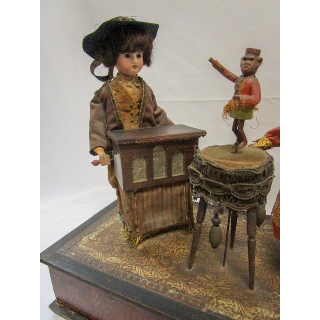 This rare playful presentation features wonderful detailed faces, charming actions and whimsical music. Arranged on a faux...