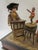 This rare playful presentation features wonderful detailed faces, charming actions and whimsical music. Arranged on a faux...