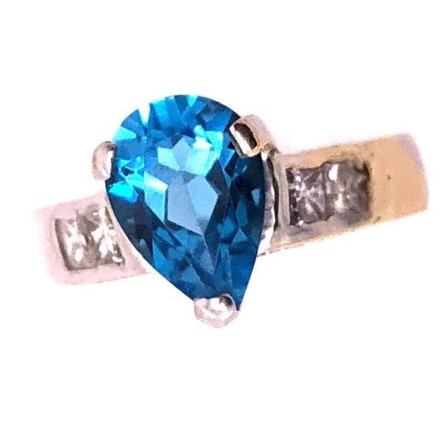 18 Karat White Gold Contemporary Blue Topaz Ring 0.72 Total Diamond Weight. Size 6.5 4 grams total weight.