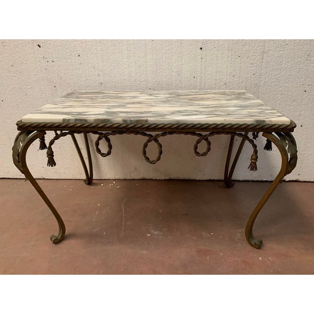 Wrought iron coffee table Four cabriole legs decorated with foliage Breccia marble top Good condition Dimensions: H 45 x W...