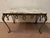 Wrought iron coffee table Four cabriole legs decorated with foliage Breccia marble top Good condition Dimensions: H 45 x W...