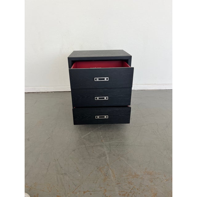 Three soft close drawers with signature red lacquer interior Jewelry-like drawer pulls in stainless steel and satin brass...