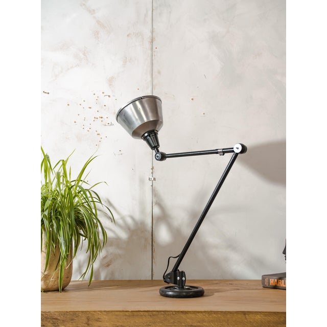1950s midgard r1 adjustable lamp, a rare piece of german industrial design history. specifications: brand: midgard model:...