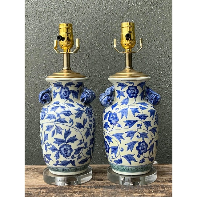 This exquisite pair of vintage Chinoiserie table lamps captures the timeless allure of traditional blue and white...