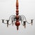 Five-arm chandelier with a hand-turned wood body in original barn red paint and hand-forged wrought iron arms that curl...