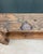 This antique solid oak carpenter's workbench likely dates from the first half of the 20th century. Bearing the marks of...