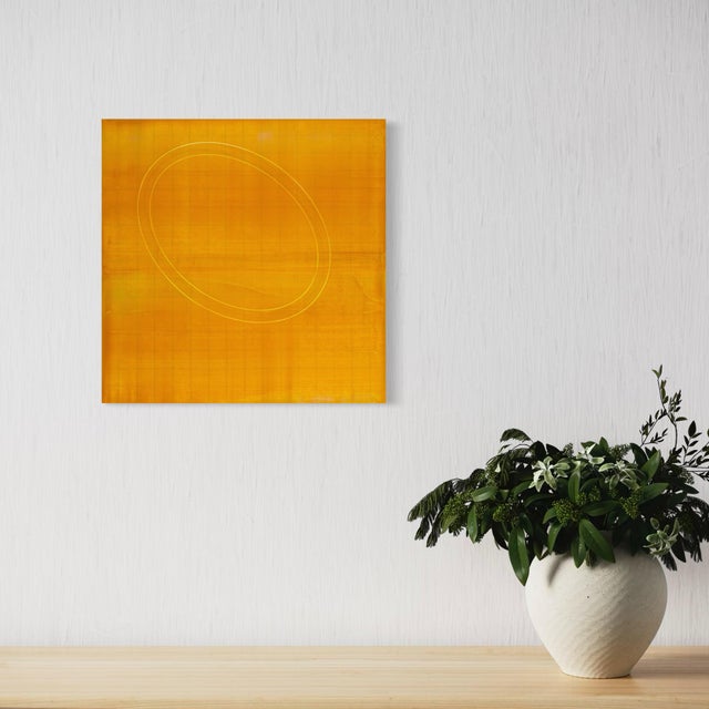 A soft, golden field carries a single faint circle near its edge, the surface built from Koury's signature layered,...