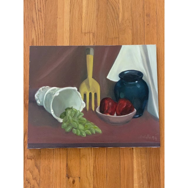 Original signed canvas still life painting of fruit and decor and an unexpected garden fork. Bold deep color tones....