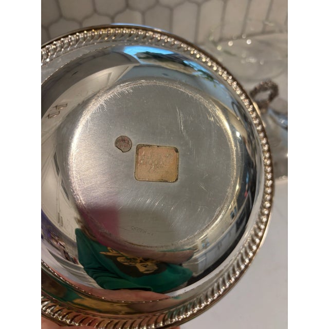 Offered is a silver plated covered serving bowl with glass Pyrex insert.