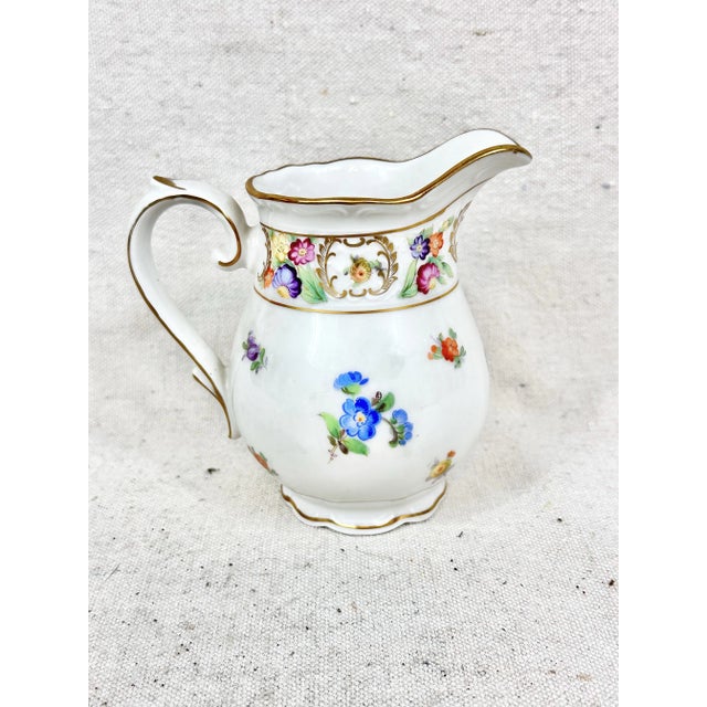 Lovely vintage creamer. Made by Schumann in Germany. Name of the pattern is Dresden Flowers. It was in production between...