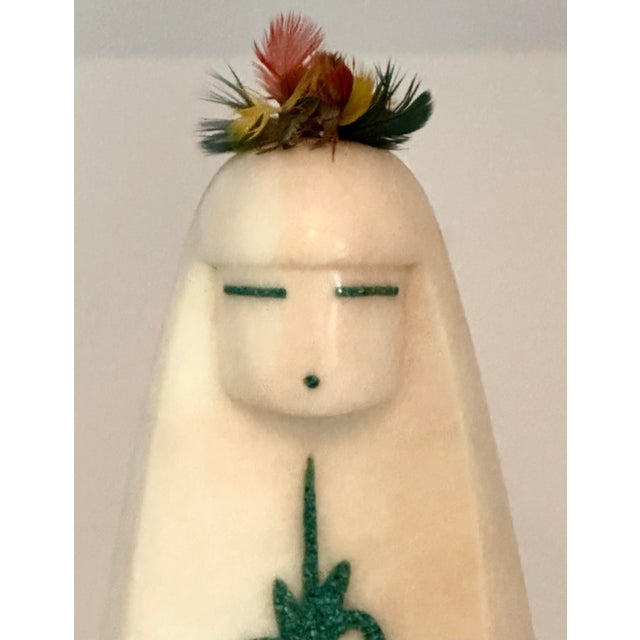 A finely carved alabaster “Corn Maiden” sculpture by Jemez Pueblo artist Matthew Panana, dating to the late 20th century....