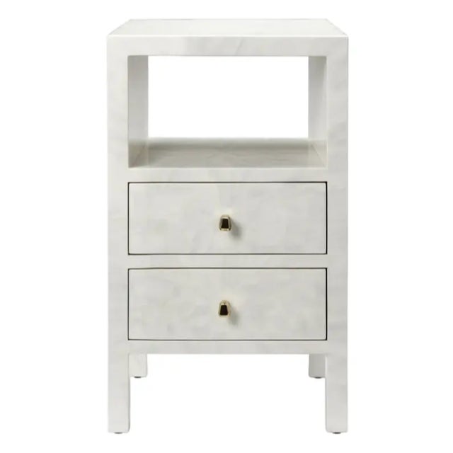 The Phoenix Nightstand features mesmerizing faux-horn accents and intricate patterns radiating from the center. It has two...