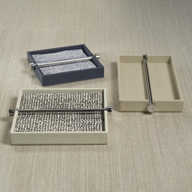 Elevate your table setting with this refined leather napkin holder, designed to keep napkins secure while adding a...