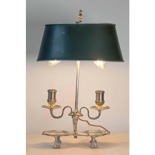 This 20th-century French bouillotte lamp exudes timeless elegance, combining functionality with refined artistry. Crafted...