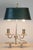 This 20th-century French bouillotte lamp exudes timeless elegance, combining functionality with refined artistry. Crafted...