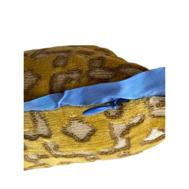 This custom pillow features a luxurious gold velvet with a textured, intricate geometric pattern in soft brown tones,...