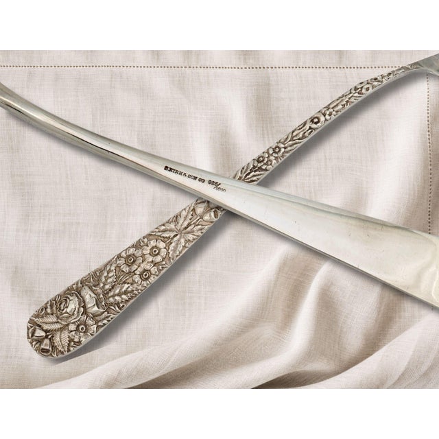 An impressive Kirk Stieff Repousse sterling silver serving spoon in the iconic Rose pattern. At 12 inches long, this...