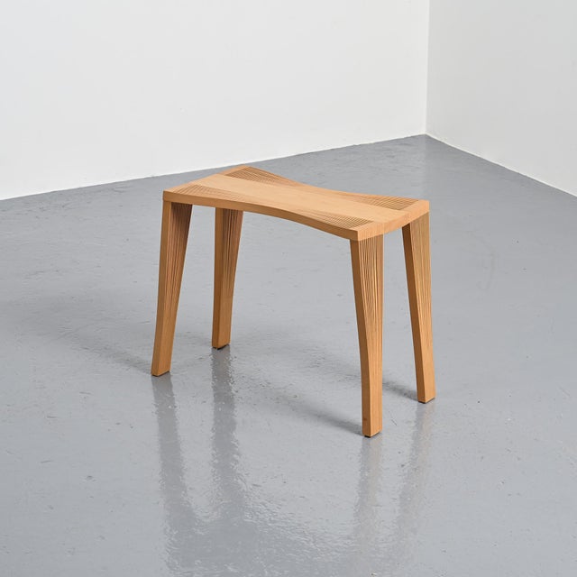 The "Female" bench, designed by Florian Artmann in Germany in 2022. Made of solid beech, it consists of a series of thin,...