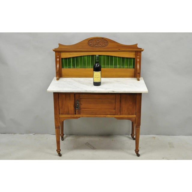 Antique English Arts & Crafts Birch Wood Green Iridescent Tile Backsplash Washstand Server with White Marble Top. Circa...