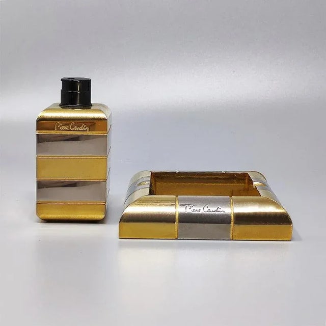 1970s gorgeous smoking set by pierre cardin in brass and metal. Made in france. The table lighter works. This smoking set...