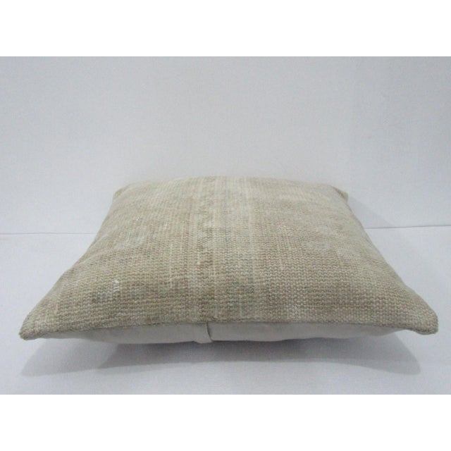 Decorative pillow cover made from a vintage Turkish handknotted rug. Backed with good quality cotton fabric. Pillow...