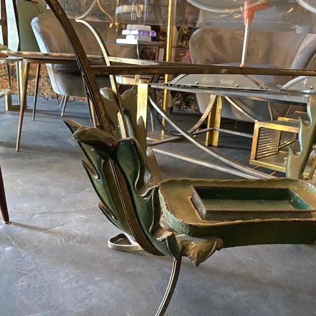 It's a wood, brass and glass italian side table designed by Pier Luigi Colli, probably glass has been changed, it's in...