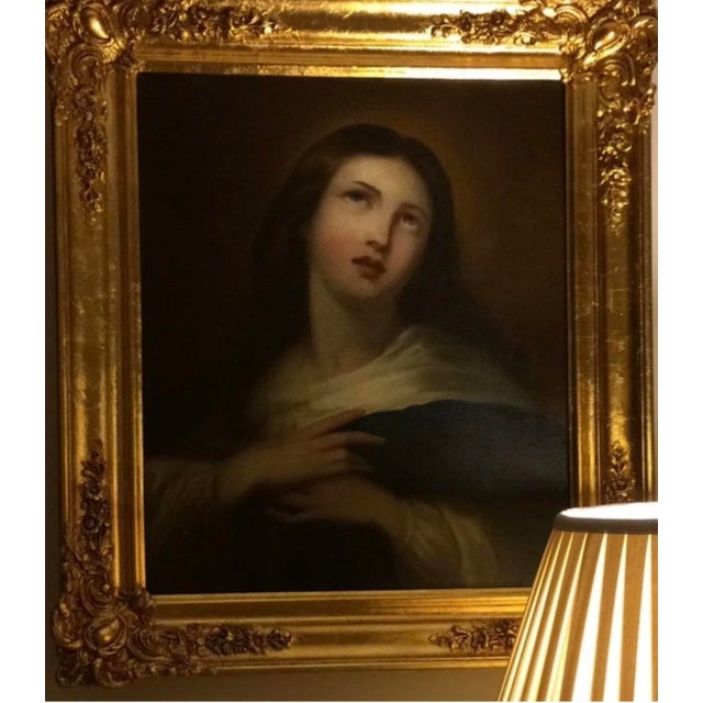Striking devotional oil painting depicting a serene female saint, possibly Mary Magdalene, rendered in the Old Master...