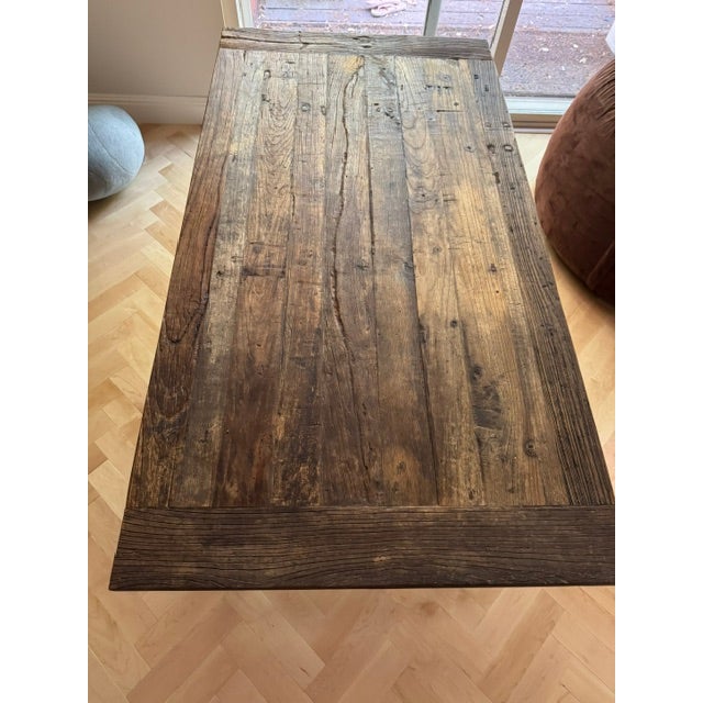 Authentic Restoration Hardware industrial table crafted from solid reclaimed wood with heavy cast iron bases. This is...