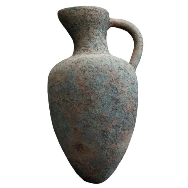 1960s terra cotta vase on metal stand with textured body. Measures approx - 14.5h x 7.5diam With stand: 18.5h