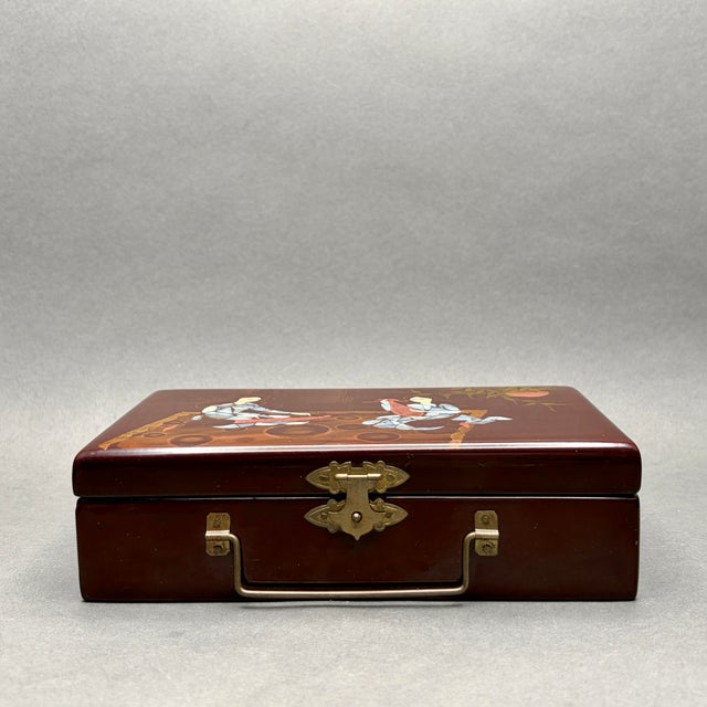 • Vietnamese lacquerware jewelry box with mother of pearl inlaid figural scene, fitted mirror and interior compartments. •...