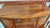 A refined late 19th-century English Hepplewhite-style sideboard crafted in richly figured mahogany with elegant satinwood-...