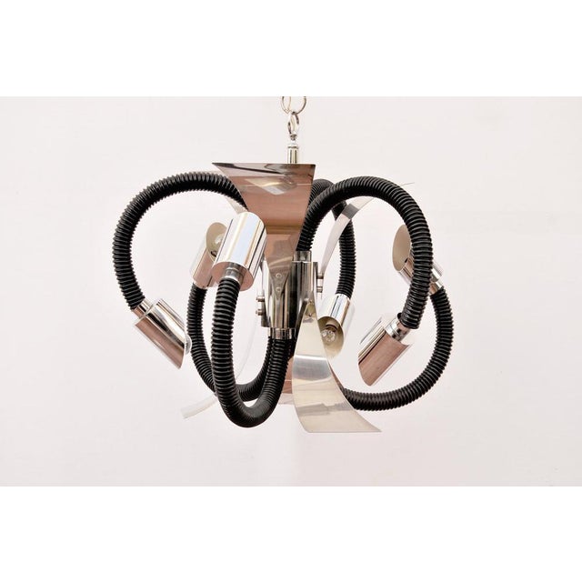 Vintage space age 1970s chandelier made of steel and plastic. Structure detail composed of chrome-plated steel sheets and...