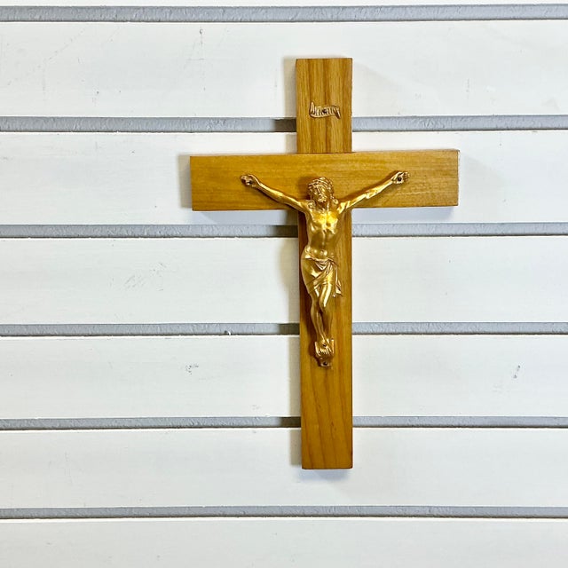 A iconic old Rustic European Crucifix. The iconic faith symbol is crafted of pine and we believe a gold-toned metal. We...