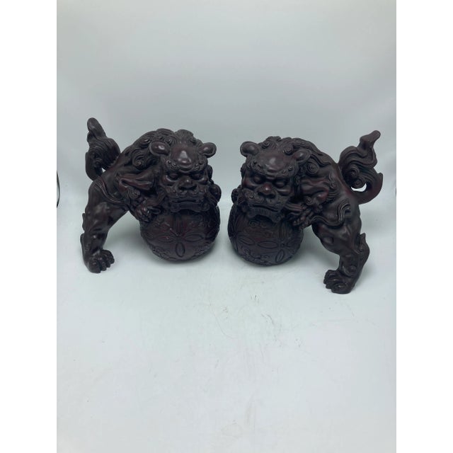 Foo dogs, protectors of the home! This elegant pair are made of a very heavy composite material. They’re beautifully...
