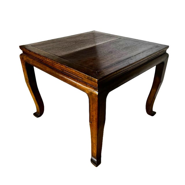 The square table is made of solid walnut wood, a hardwood that appeared to be exclusive, found only among furniture from...