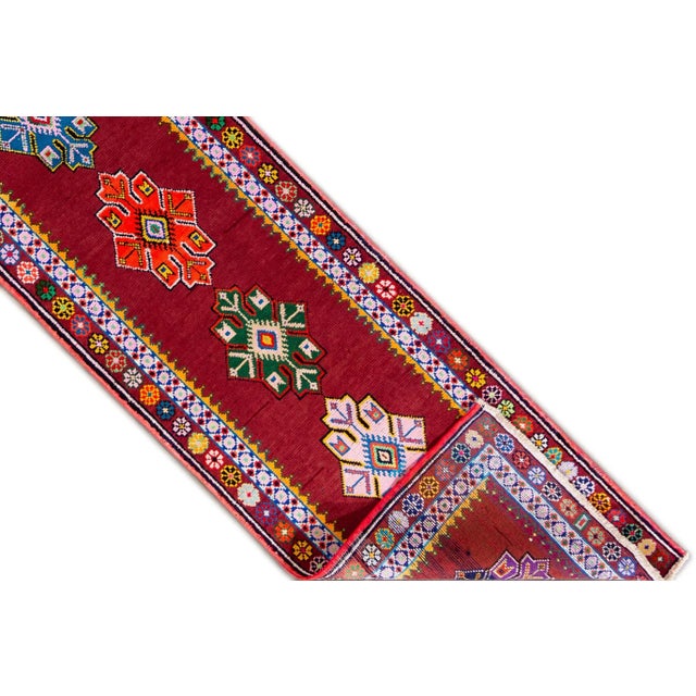 A hand knotted vintage Turkish Anatolian runner with an all-over design. This rug measures 2'9" x 13'2".