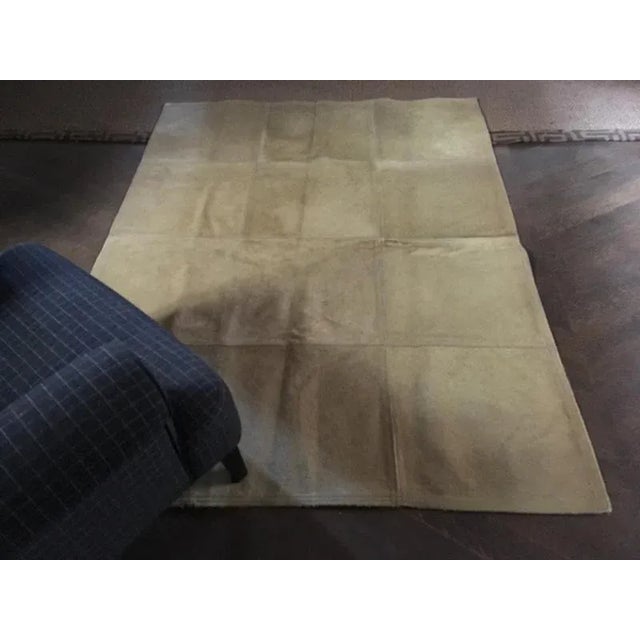 This is an elegant rug made in leather, exactly cow leather. This rug has the short tan blond fur. It has been composed by...