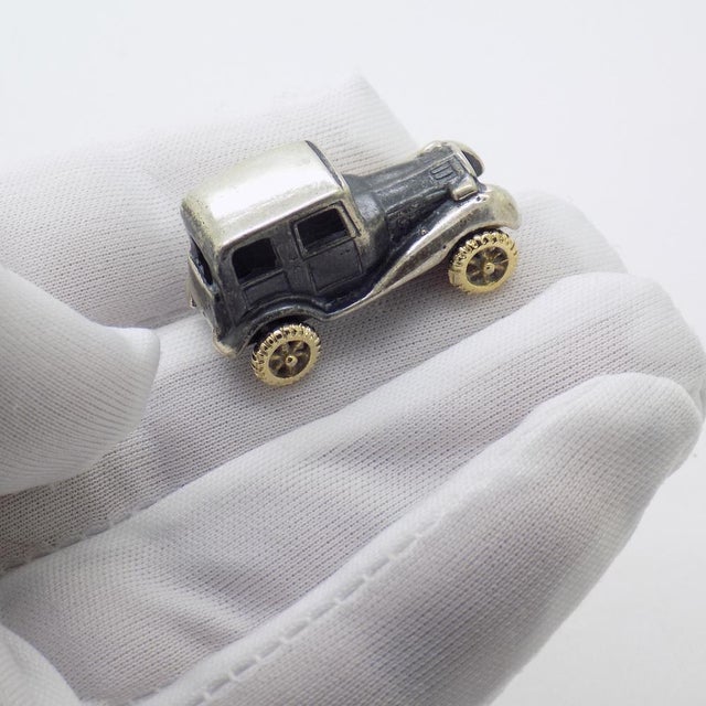 Compact vintage miniature depicting a classic car, handcrafted in Italy between the 1980s and 1990s in genuine sterling...