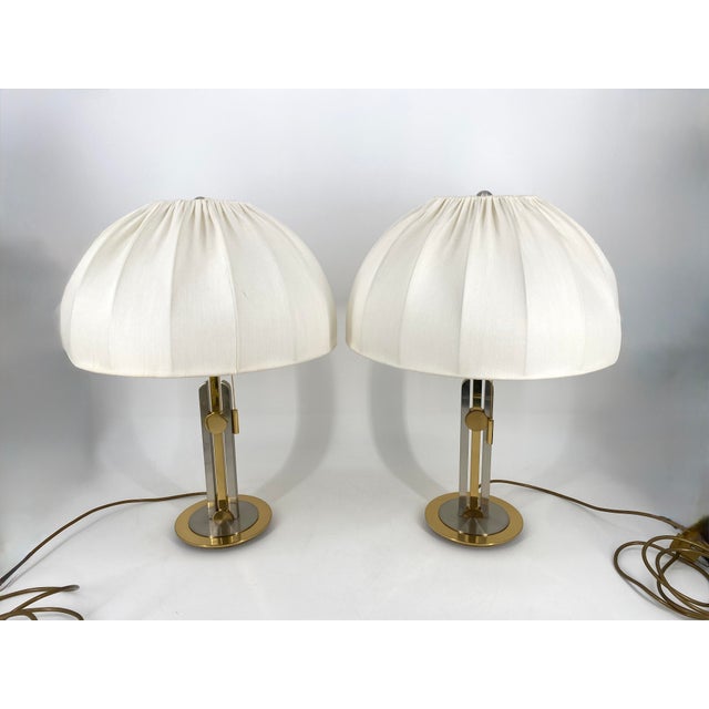 A pair of table lamps * Elegant table lamps * In the opulent design of the Hollywood Regency * Bicolor, brass and gold...