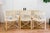 Genuine set of rare McGuire San Francisco director's style dining chairs. Two armchairs and 4 side-chairs. They feature...