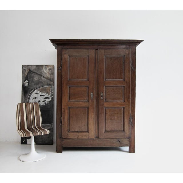 Early 19th Century French provincial hall cupboard or wardrobe. Crafted from solid oak. Ready for everyday use, with a...