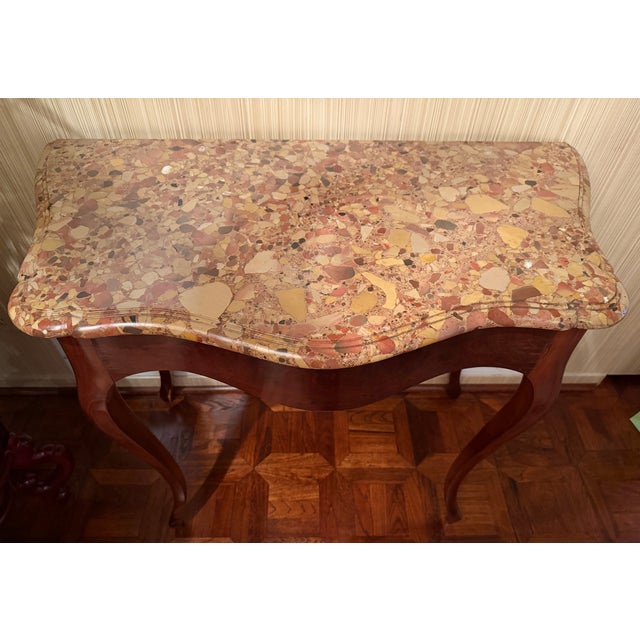 c. 1860 Napoleon III antique console with beveled, tiered marble top. Delicately curved palissandre legs and apron, rubbed...