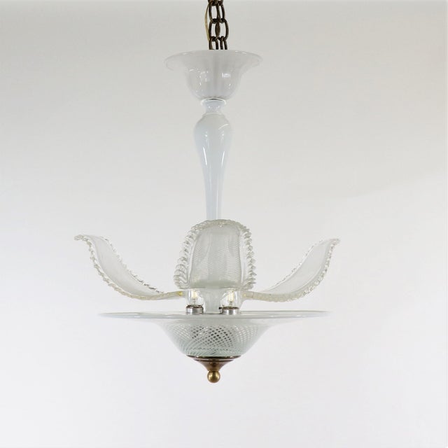 This delicately handcrafted mid-century latticino Murano light is adorned with three beautiful glass leaves. The latticino...