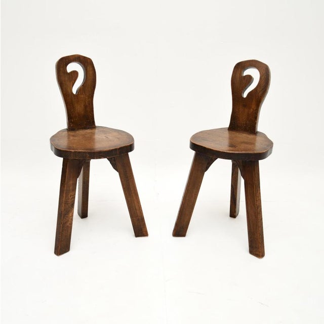A charming and extremely well made pair of vintage Brutalist side chairs in solid elm. They were made in England, they...
